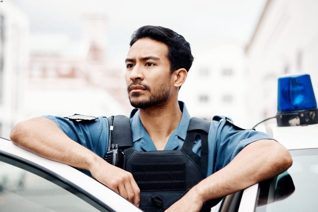 police man standing outside car