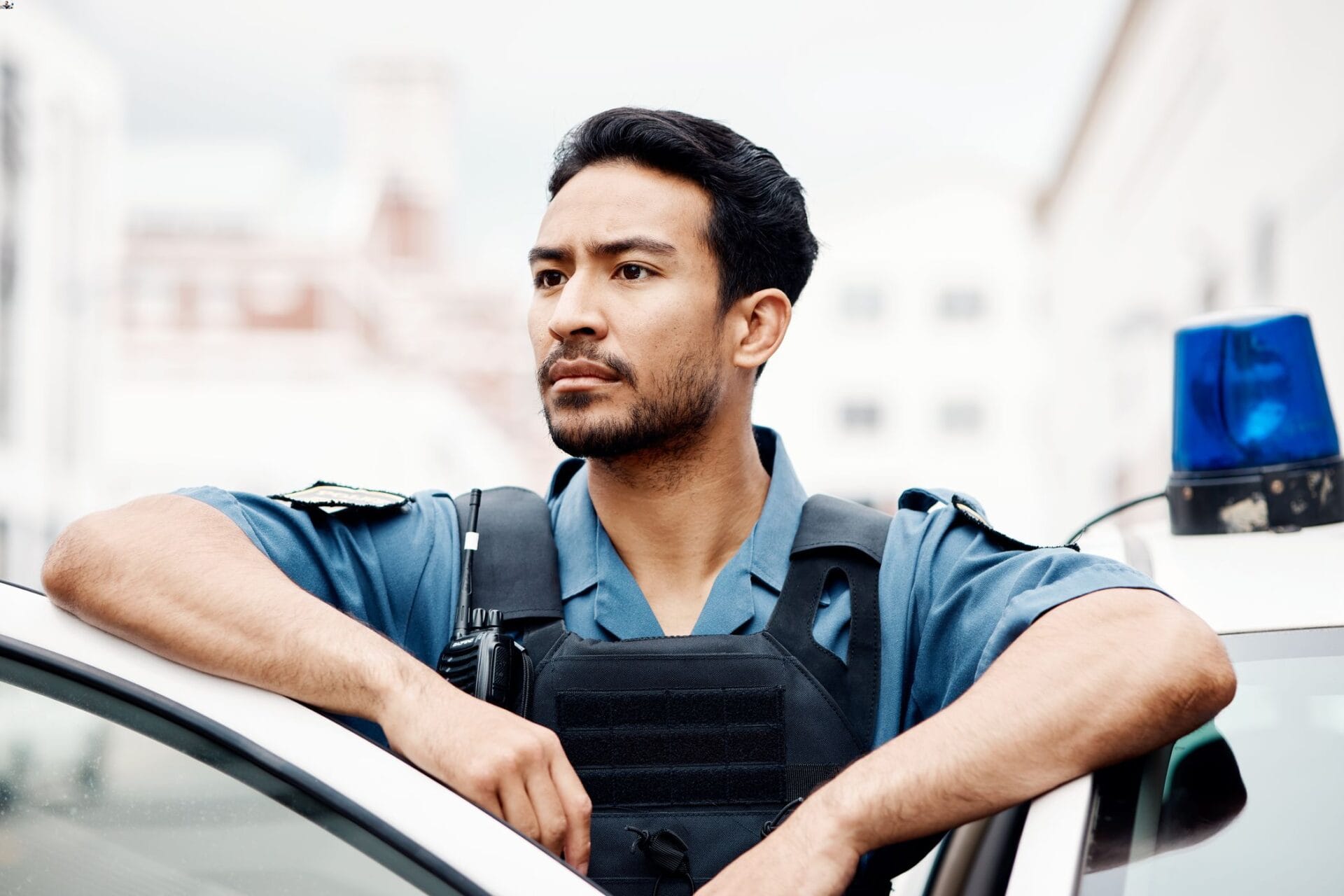 police man standing outside car
